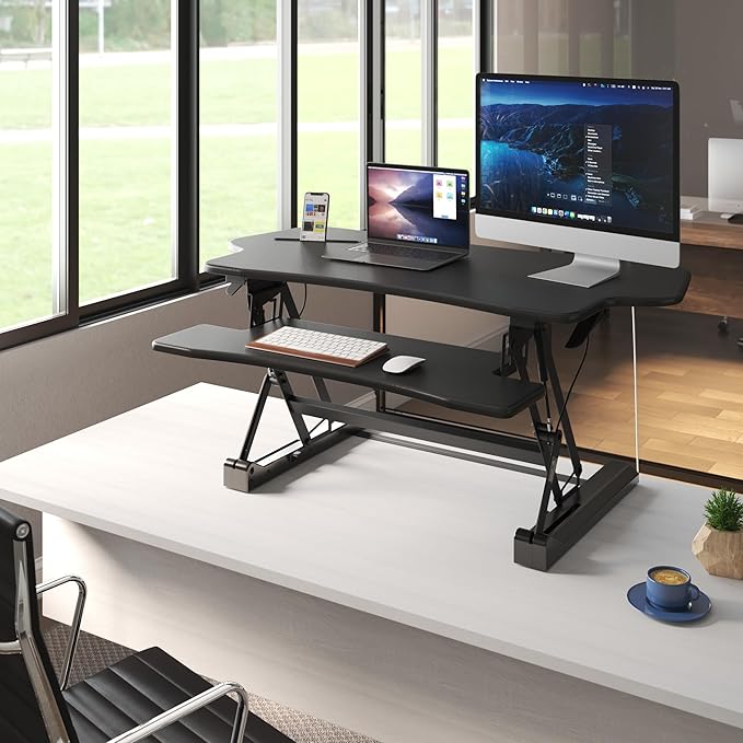 Mount-It! Standing Desk Converter, 48" Wide Sit Stand Desk Riser with Dual Gas Spring Handles, Height Adjustable from 6"–19.25", Extra Large Tabletop for 2 Monitors, Keyboard Tray & Device Slot, Black